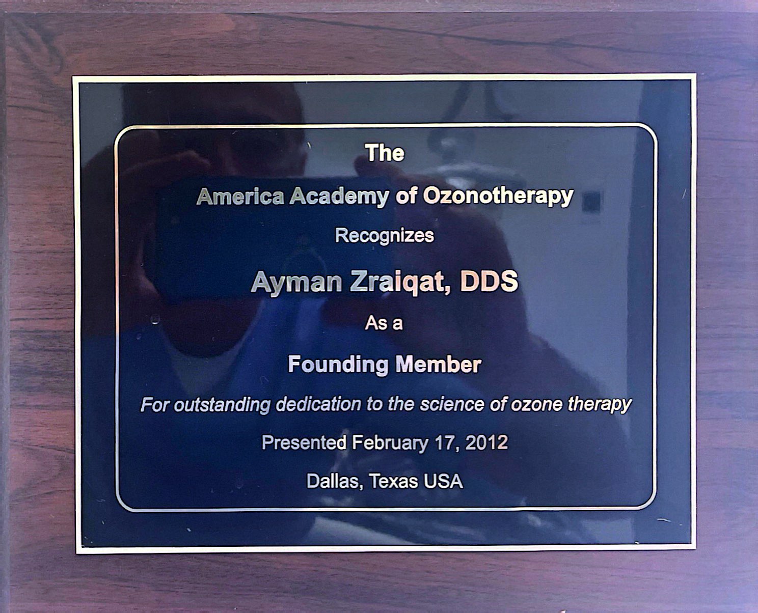 A plaque recognizing Ayman Zraiqat, DDS, as a founding member of the America Academy of Ozonotherapy, dated February 17, 2012.